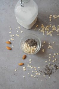 Ingredients for almond milk overnight oats with oats, chia seeds, and almonds