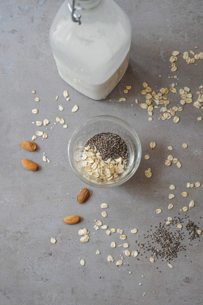 Ingredients for almond milk overnight oats with oats, chia seeds, and almonds