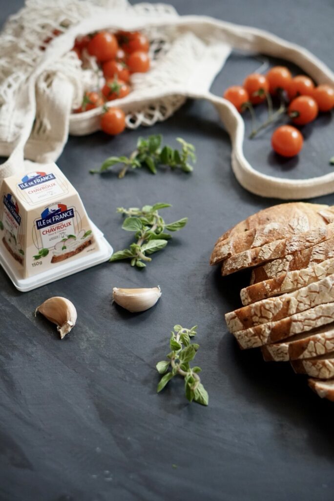 Ingredients for tomato ricotta toast with sourdough bread and cherry tomatoes