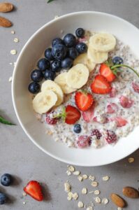 Overnight oats with almond milk, banana, strawberries, and blueberries