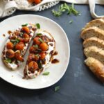 Easy tomato ricotta toast served with roasted cherry tomatoes