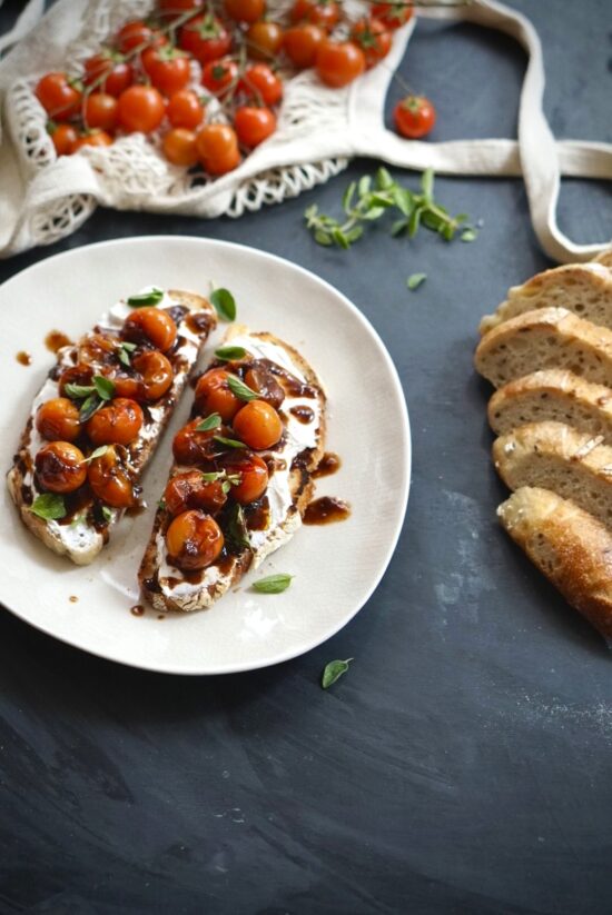 Easy tomato ricotta toast served with roasted cherry tomatoes