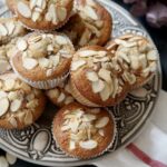 Close-up of cherry almond buttermilk muffins on a patterned plate