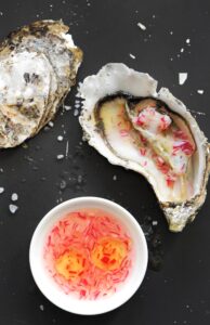 Fresh oyster served with red onion mignonette sauce