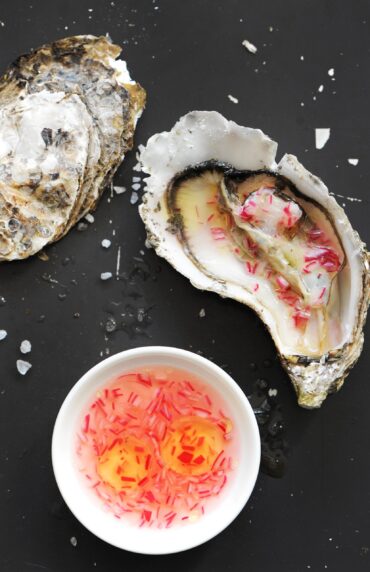 Fresh oyster served with red onion mignonette sauce