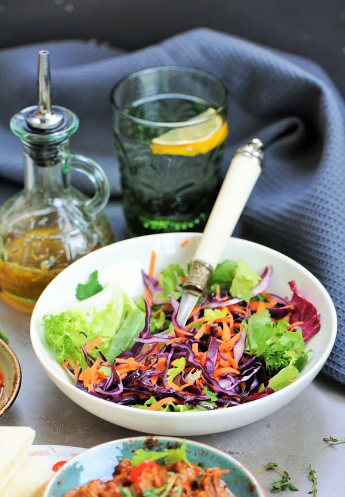 Crunchy red cabbage and carrot salad served with Dutch oven braised beef