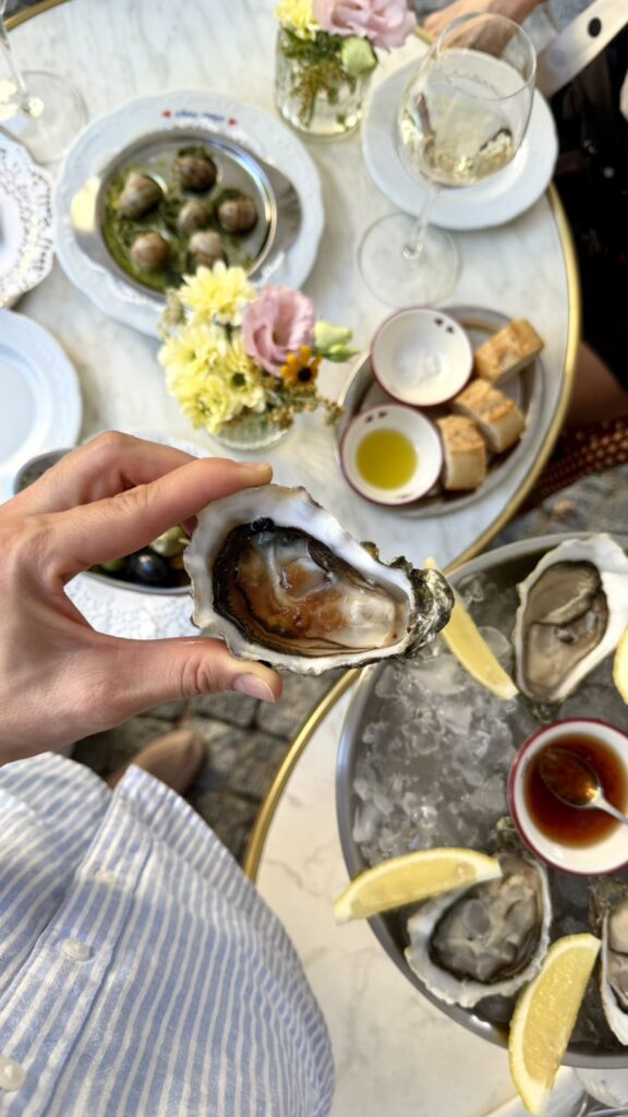 Fresh raw oyster topped with red onion mignonette sauce