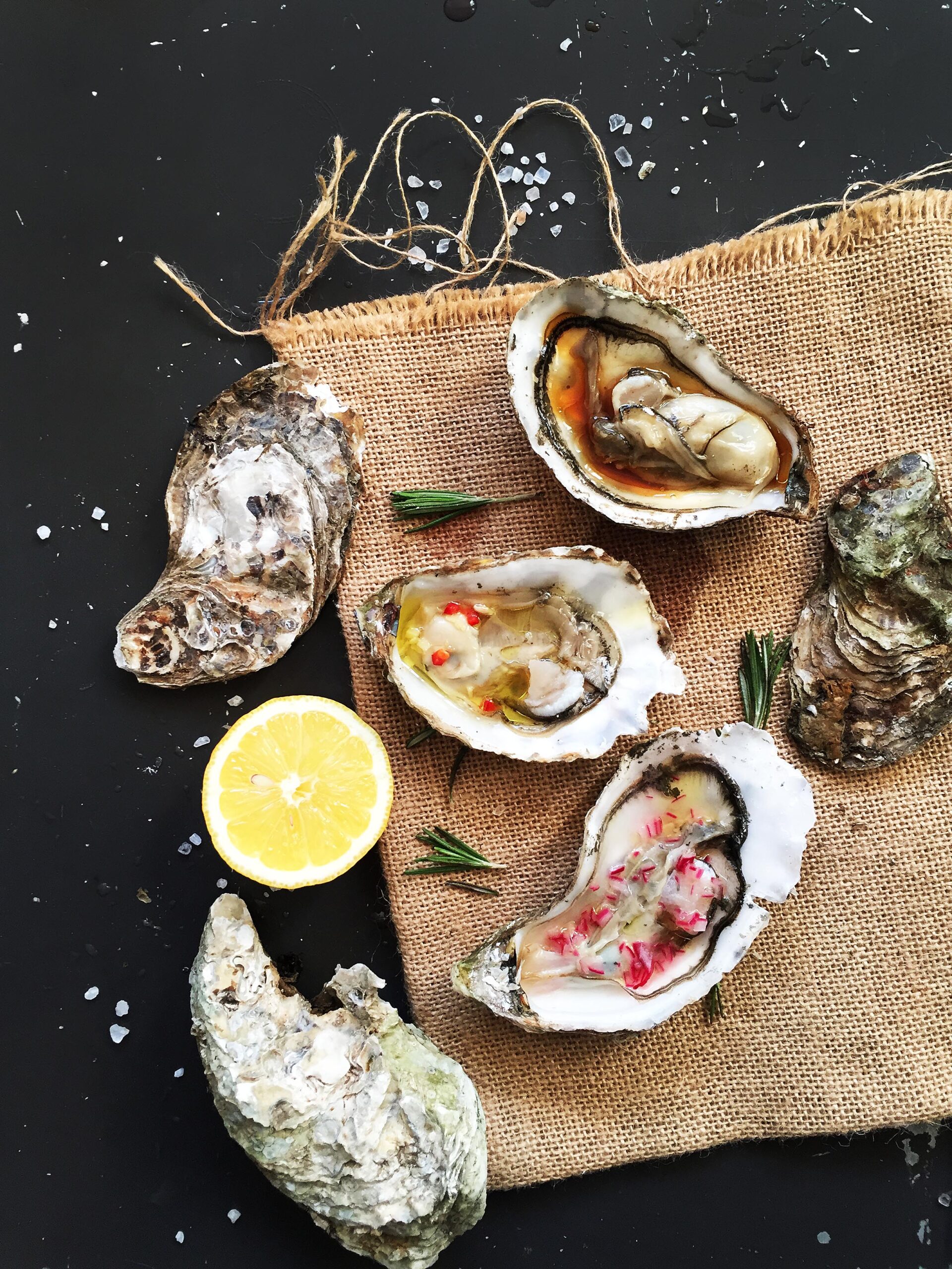 Three fresh oysters served with mignonette, lemon ginger, and soy lemon sauces