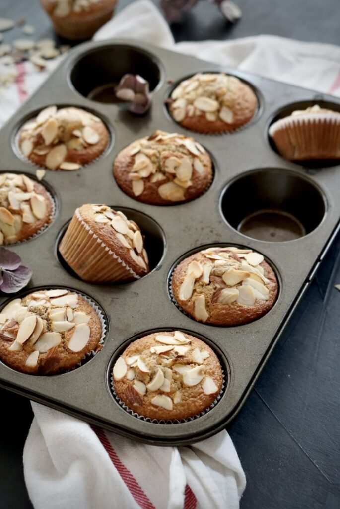 Freshly baked cherry buttermilk muffins with almond flour in a muffin tin