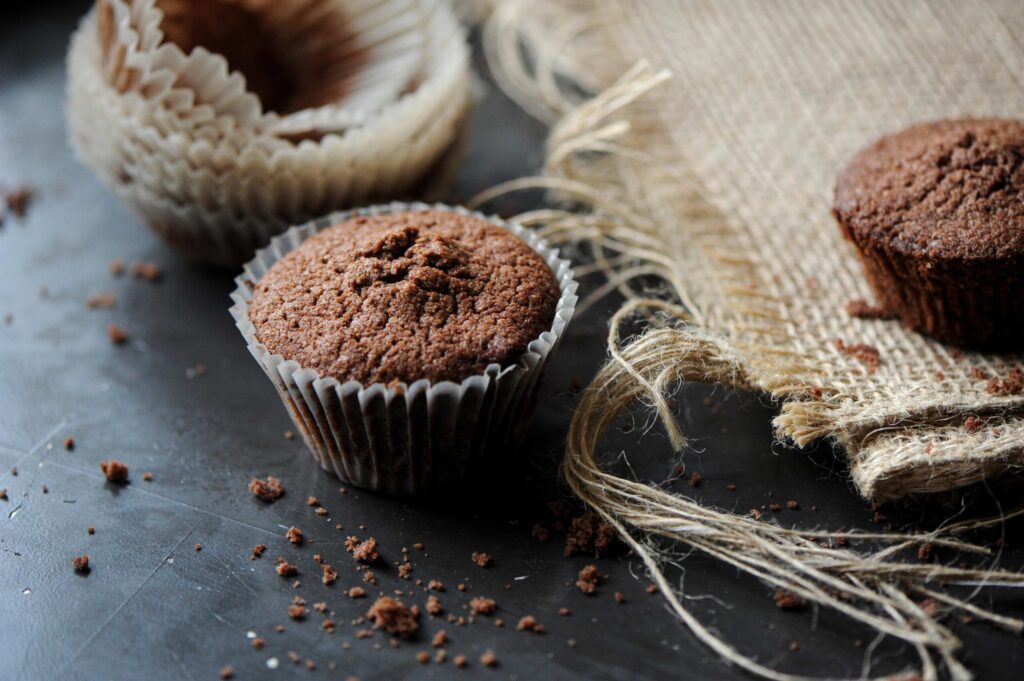 Homemade dark chocolate muffins in paper liners