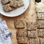 Homemade gluten-free almond flour crackers with white and black sesame seeds
