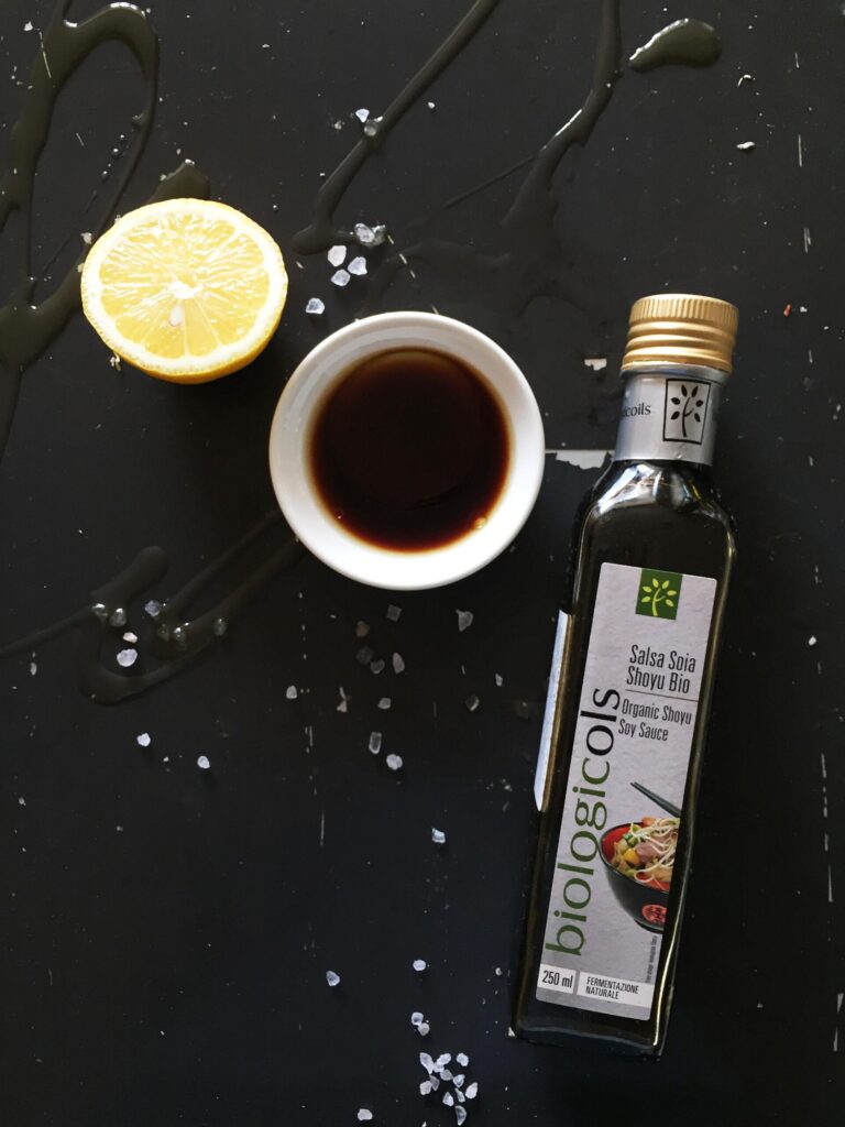 Ingredients for soy lemon oyster sauce: soy sauce, fresh lemon, and olive oil
