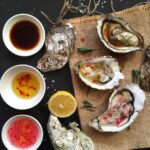 Three homemade sauces for oysters: mignonette, lemon ginger, and soy lemon