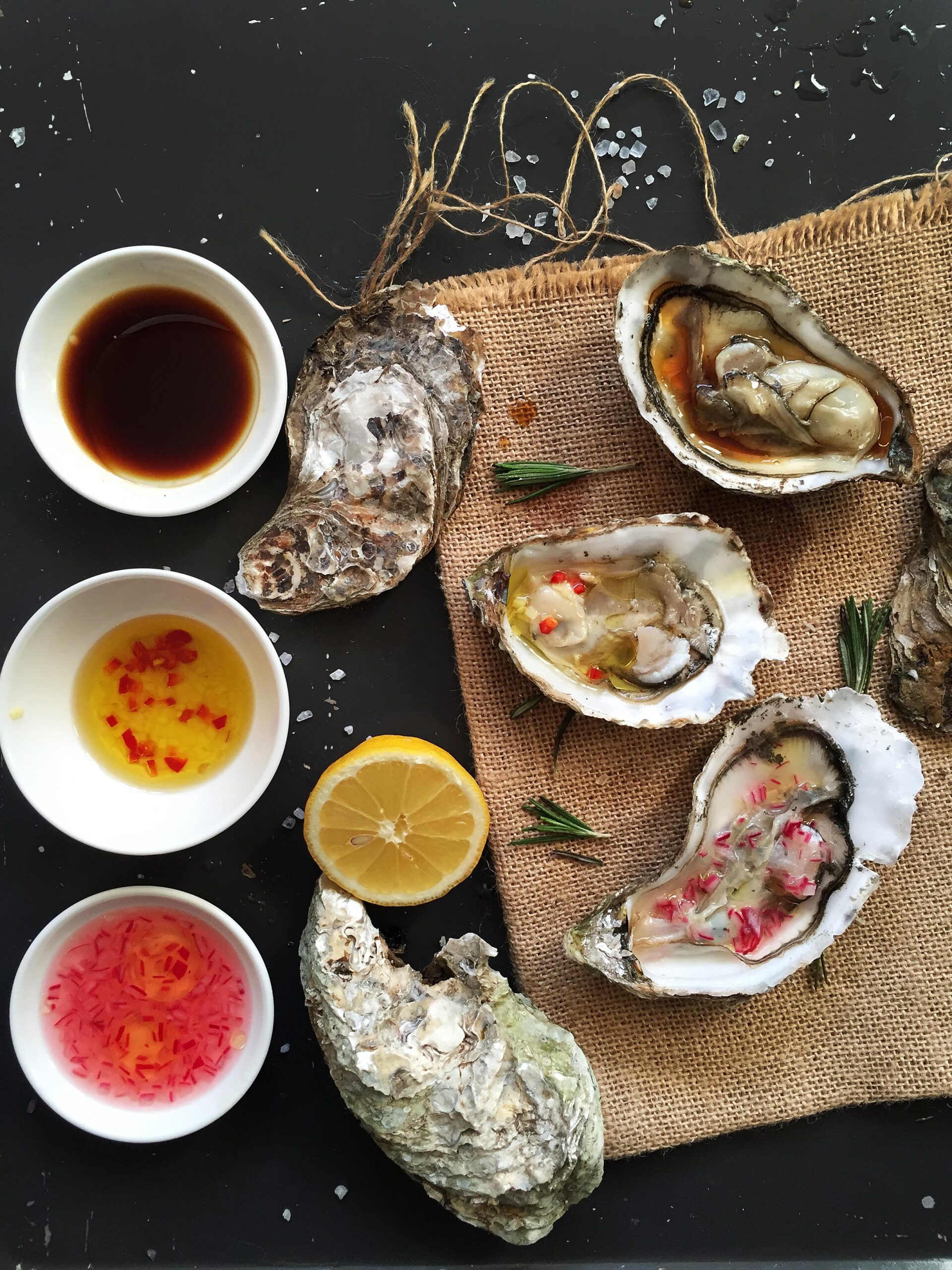 Three homemade sauces for oysters: mignonette, lemon ginger, and soy lemon