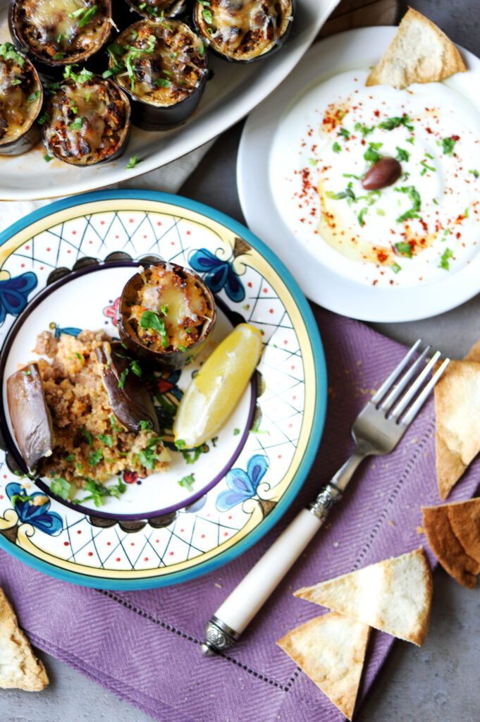 Turkish-style stuffed eggplant dinner with seasoned yogurt and toasted pita