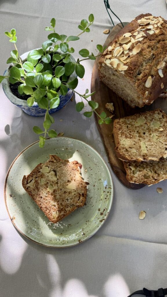 Slice of homemade apple bread with fresh apple pieces