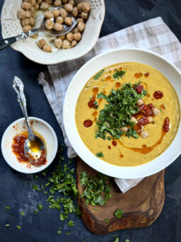 Creamy green lentil soup with chickpeas, parsley, and harissa