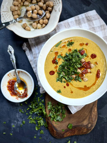 Creamy green lentil soup with chickpeas, parsley, and harissa