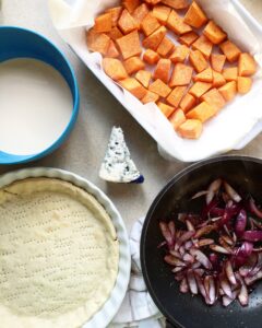 Roasted pumpkin cubes, cream, and blue cheese for quiche filling