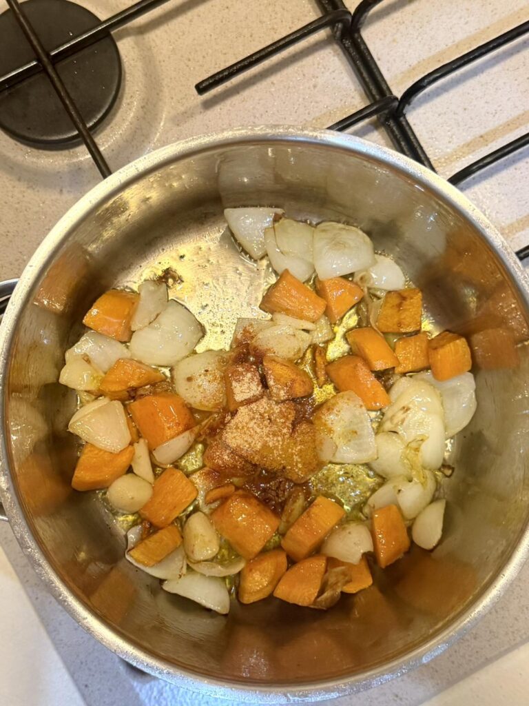 Paprika, turmeric, and ginger added to sautéed vegetables